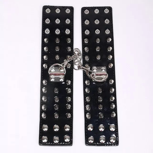 JOYGASMS Patent PU Leather Wrist Restraints with Three Row Metal Cone Spikes Black Shiny Handcuffs