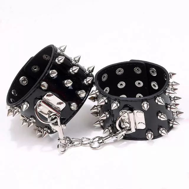 JOYGASMS Patent PU Leather Wrist Restraints with Three Row Metal Cone Spikes Black Shiny Handcuffs