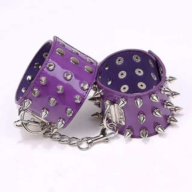 JOYGASMS Patent PU Leather Wrist Restraints with Three Row Metal Cone Spikes Purple Shiny Handcuffs